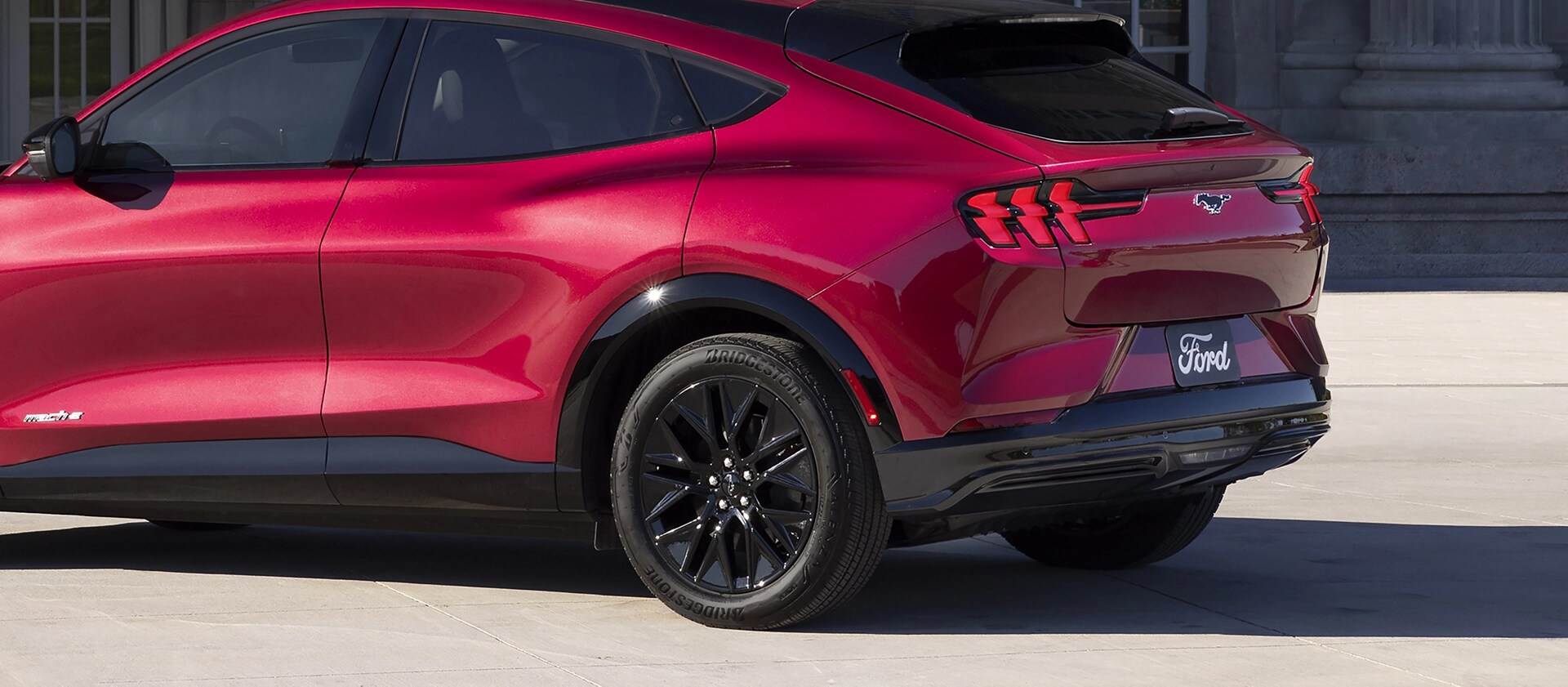 2025 Ford Mustang Mach-E® parked and highlighting the rear taillights