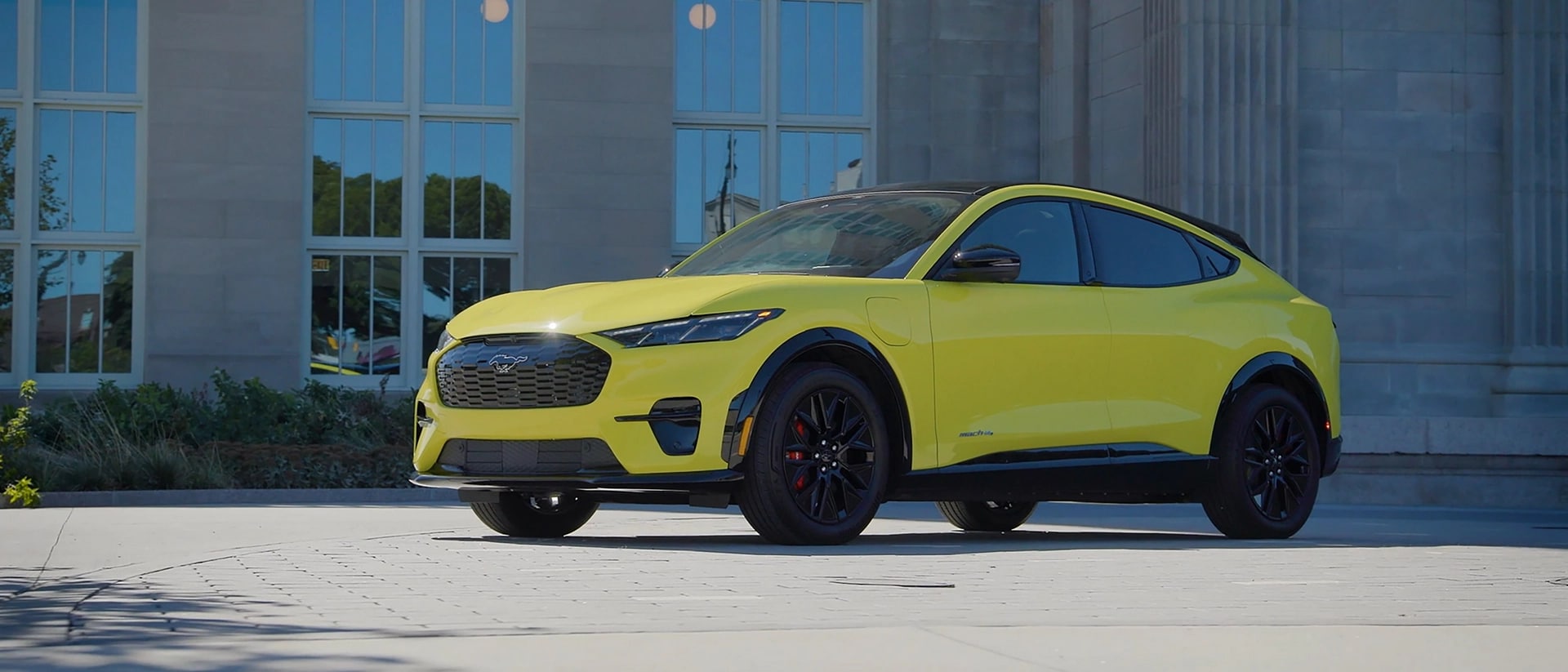 2025 Ford Mustang Mach-E Rally model parked in front of a museum