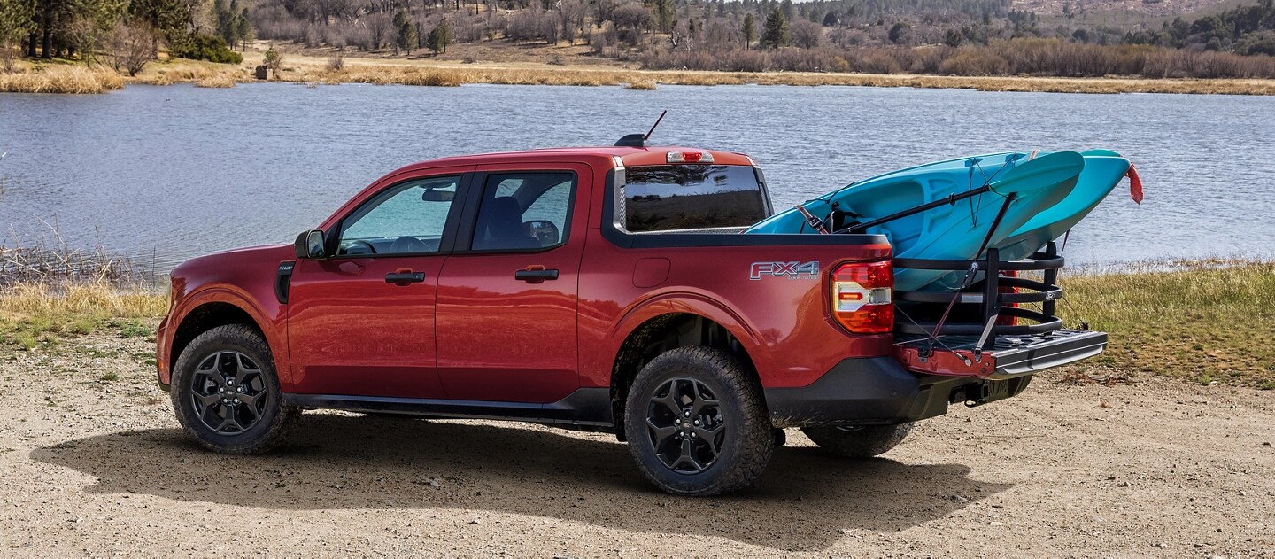 A 2025 Ford Maverick® pickup with available Bed Extender and a kayak in the bed