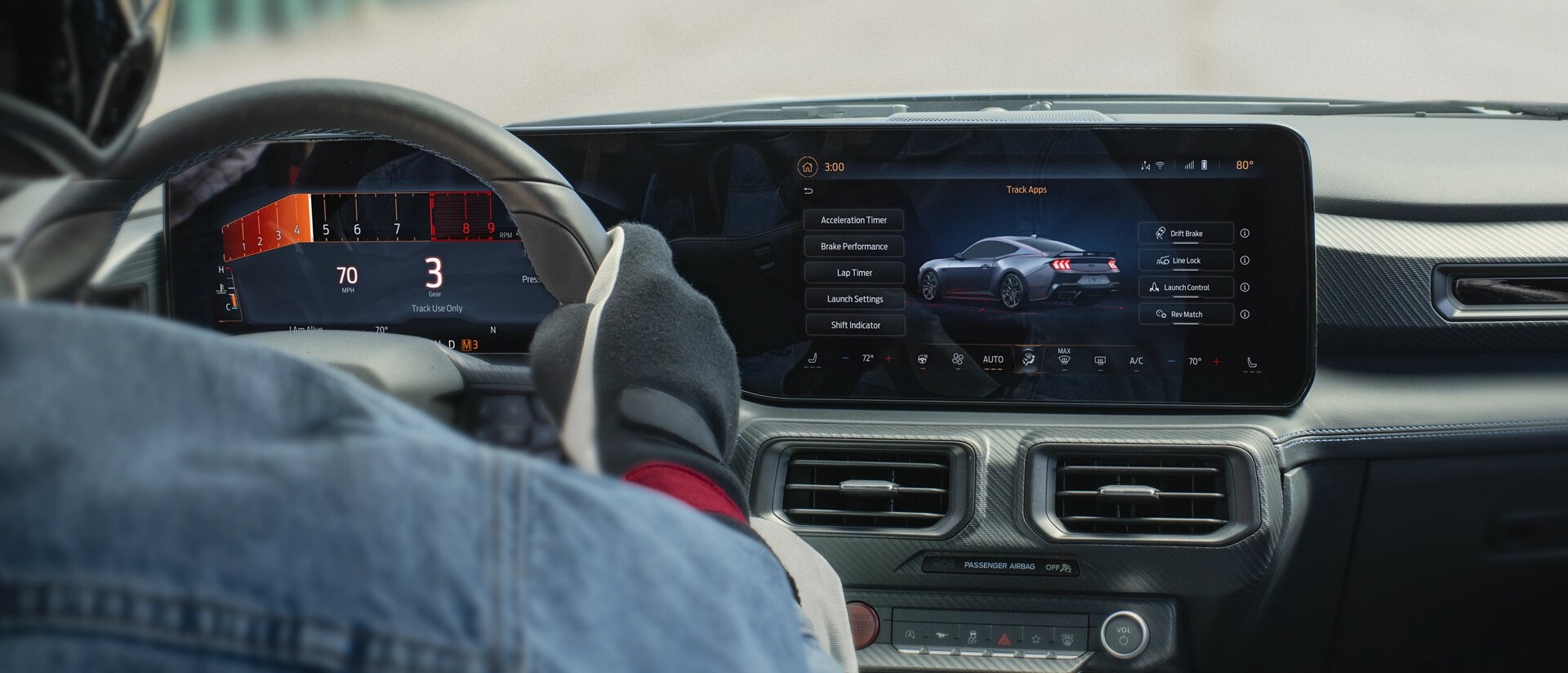 Interior view of a person driving a 2025 Ford Mustang® model on a closed course