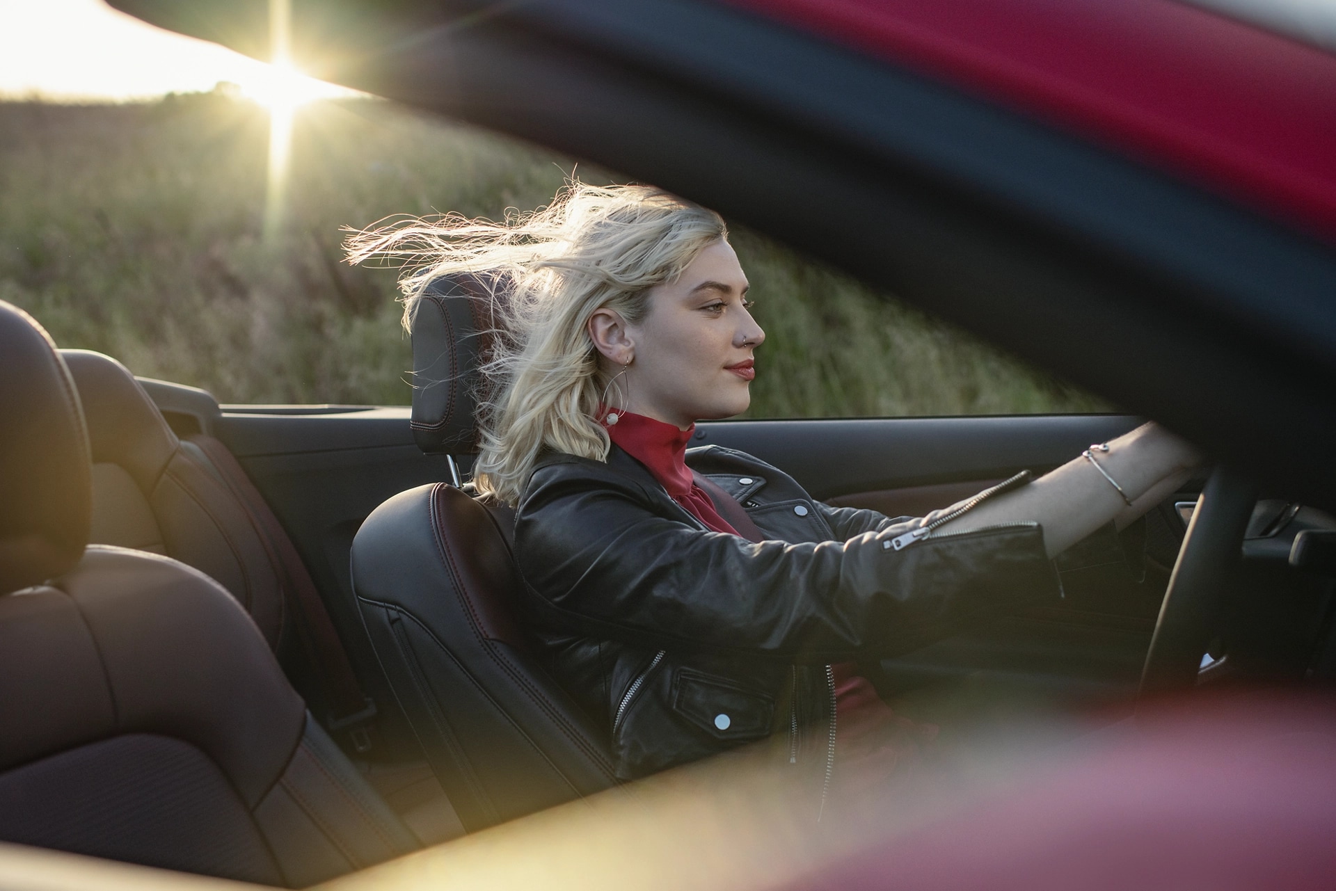 Person driving a 2025 Ford Mustang® convertible