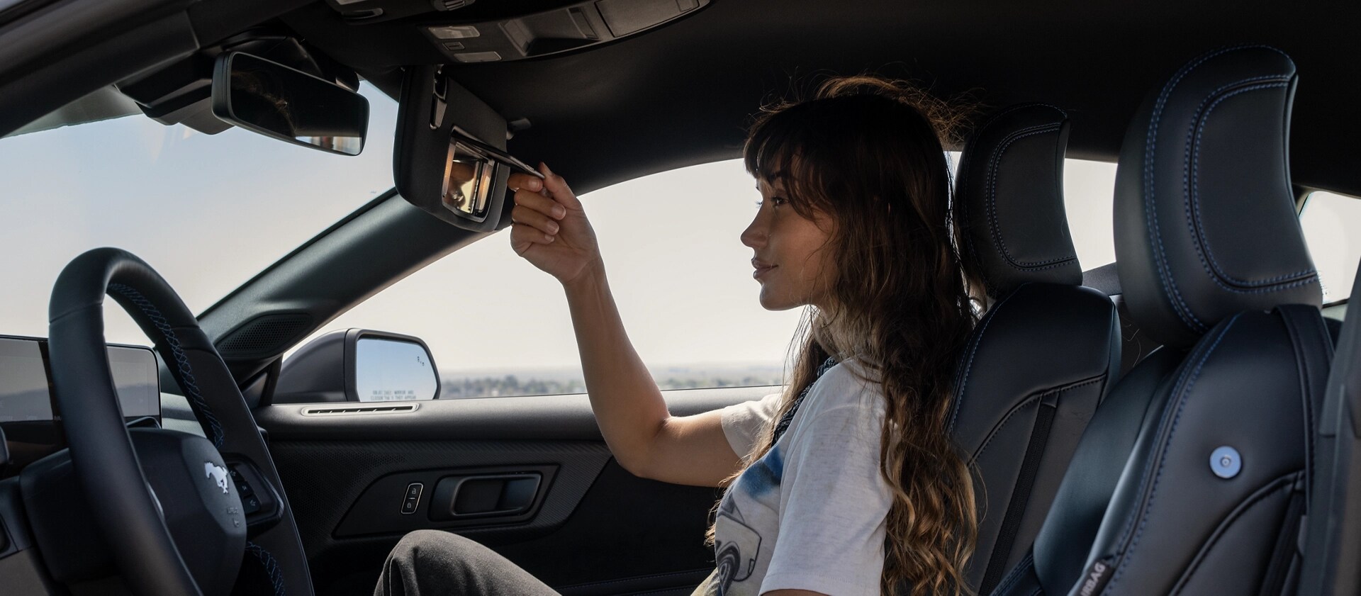 Person sitting in a 2025 Ford Mustang® Dark Horse™ coupe
