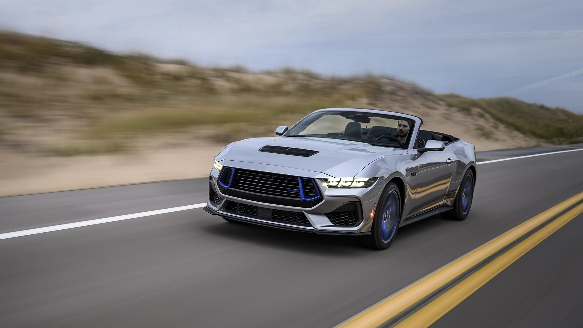 2025 Ford Mustang® GT Convertible with California Special® Package being driven on a coastal highway