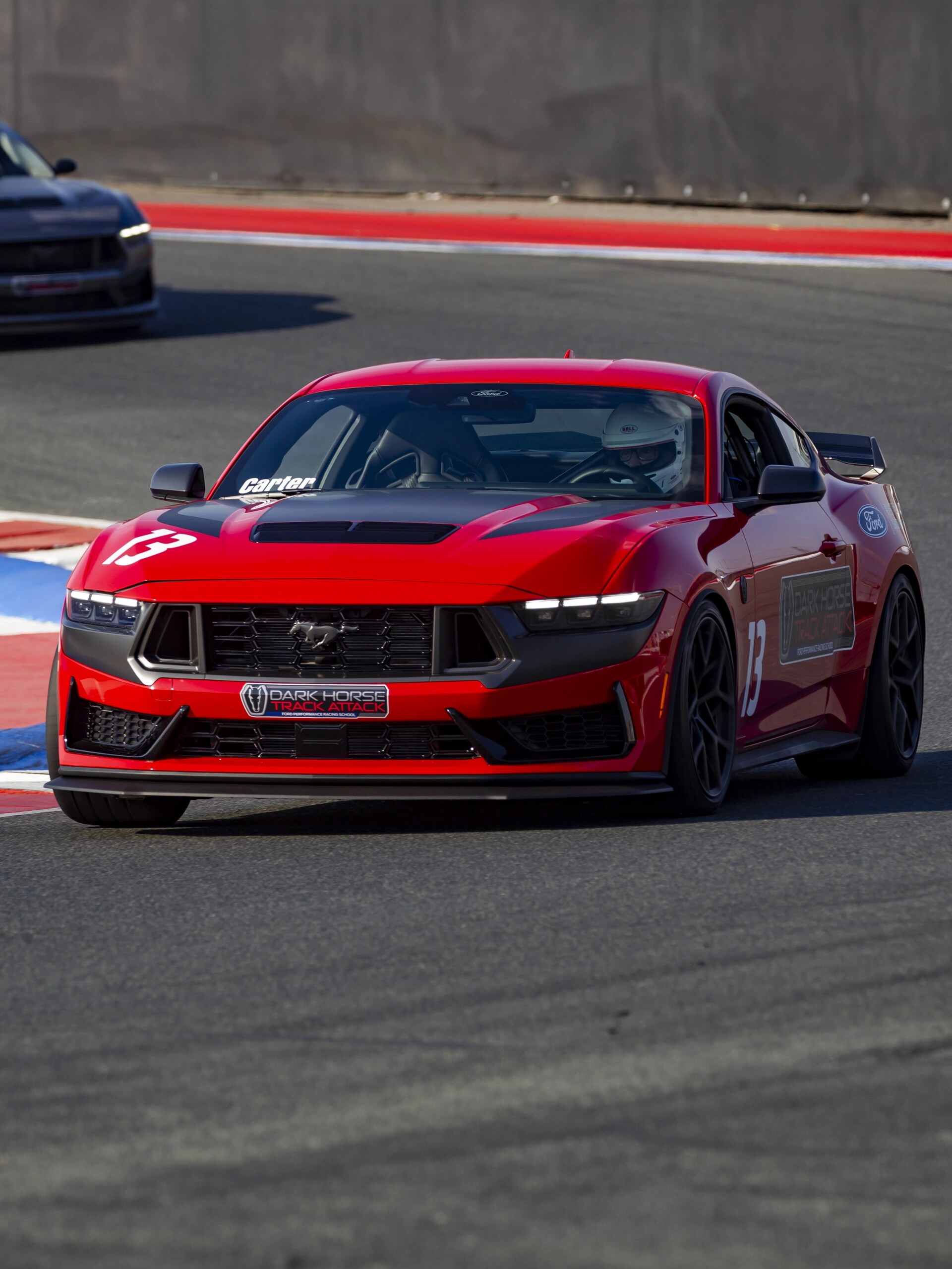 Dark Horse™ Track Attack Mustang® coupe being driven on a closed course