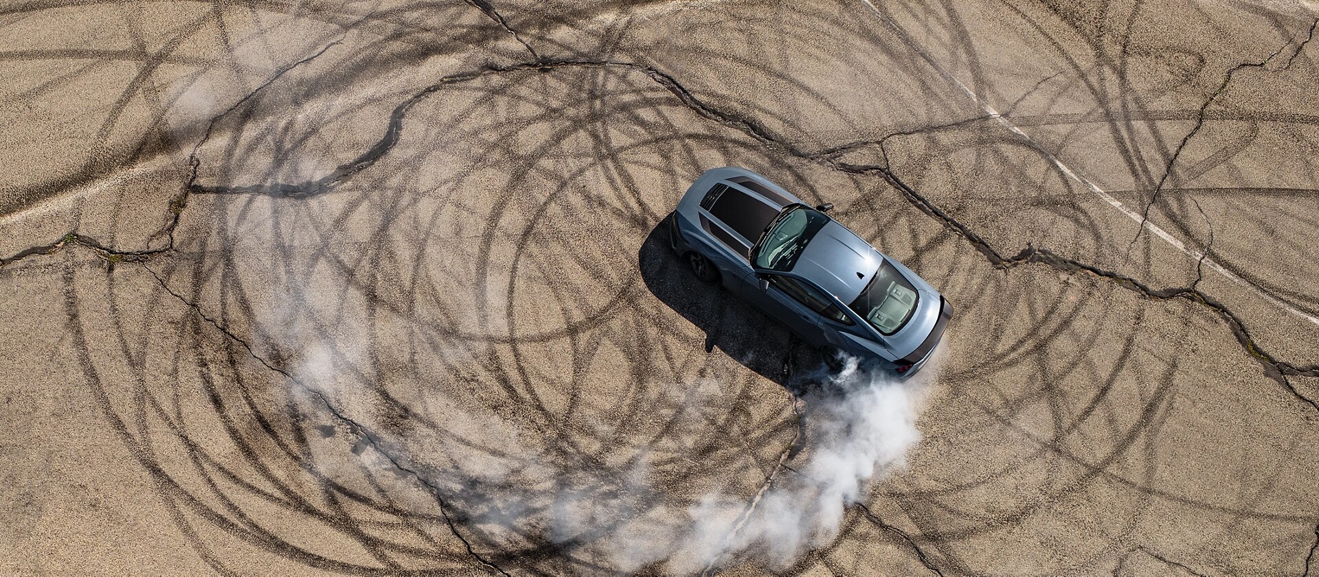 2026 Ford Mustang Dark Horse® fastback performing burnouts on a closed track