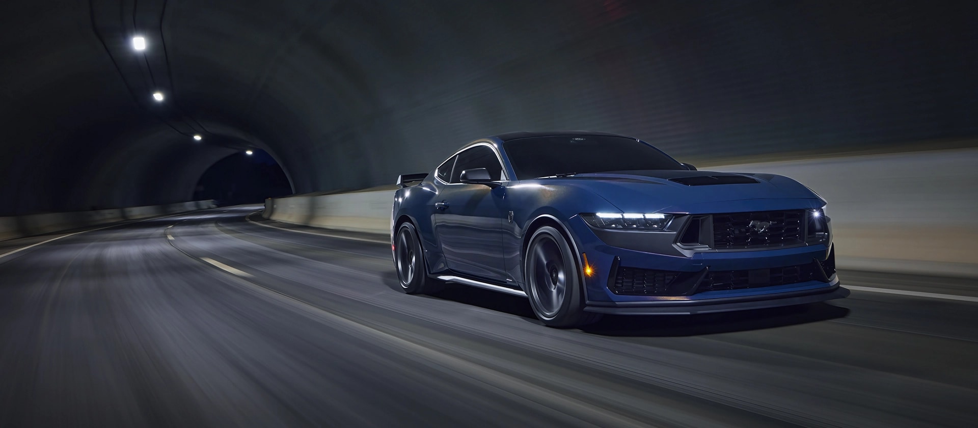 2026 Ford Mustang Dark Horse® fastback being driven in a tunnel