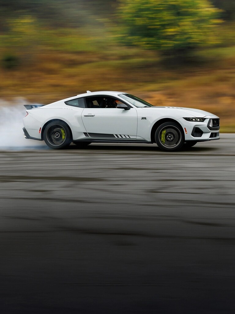 2026 Ford Mustang® RTR® fastback with a driver performing burnouts on a closed course