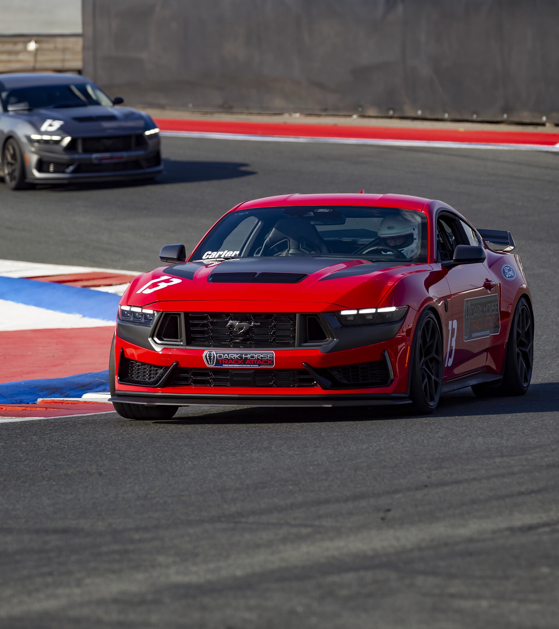 Dark Horse® Track Attack 2026 Ford Mustang® fastback being driven on a closed course