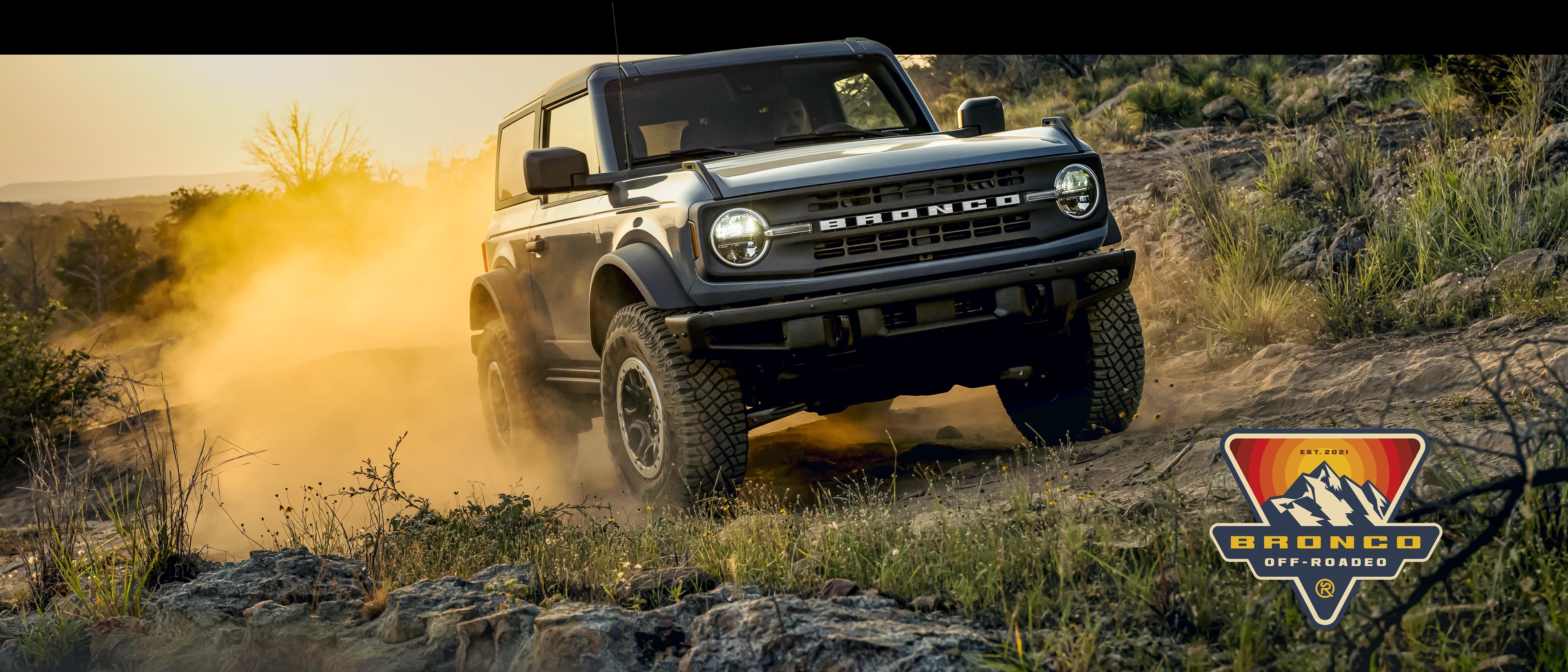 Bronco Offroadeo. A Ford Bronco climbs a rocky hillside.