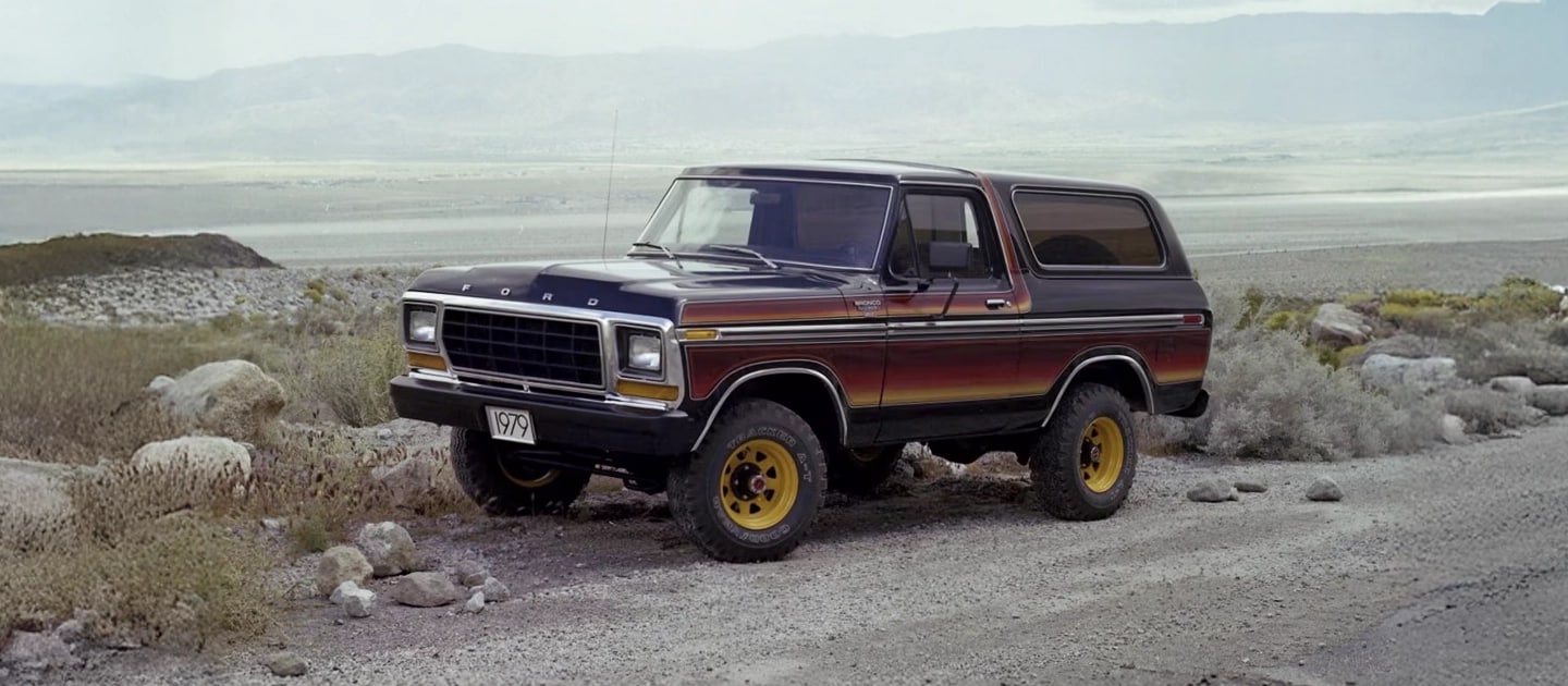 1979 Bronco parked on a gravel road.