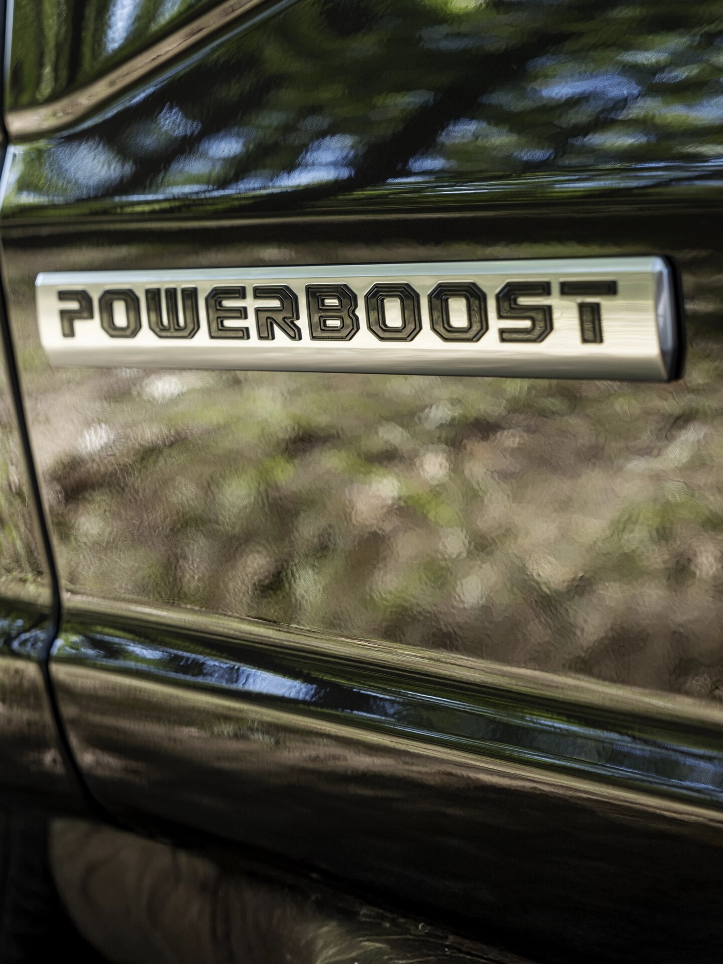 Close-up of a Powerboost badge on a Ford truck.