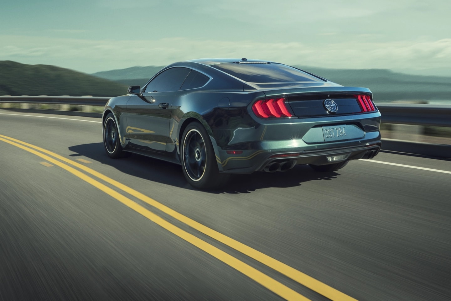 Mustang Fastback driving on a highway.