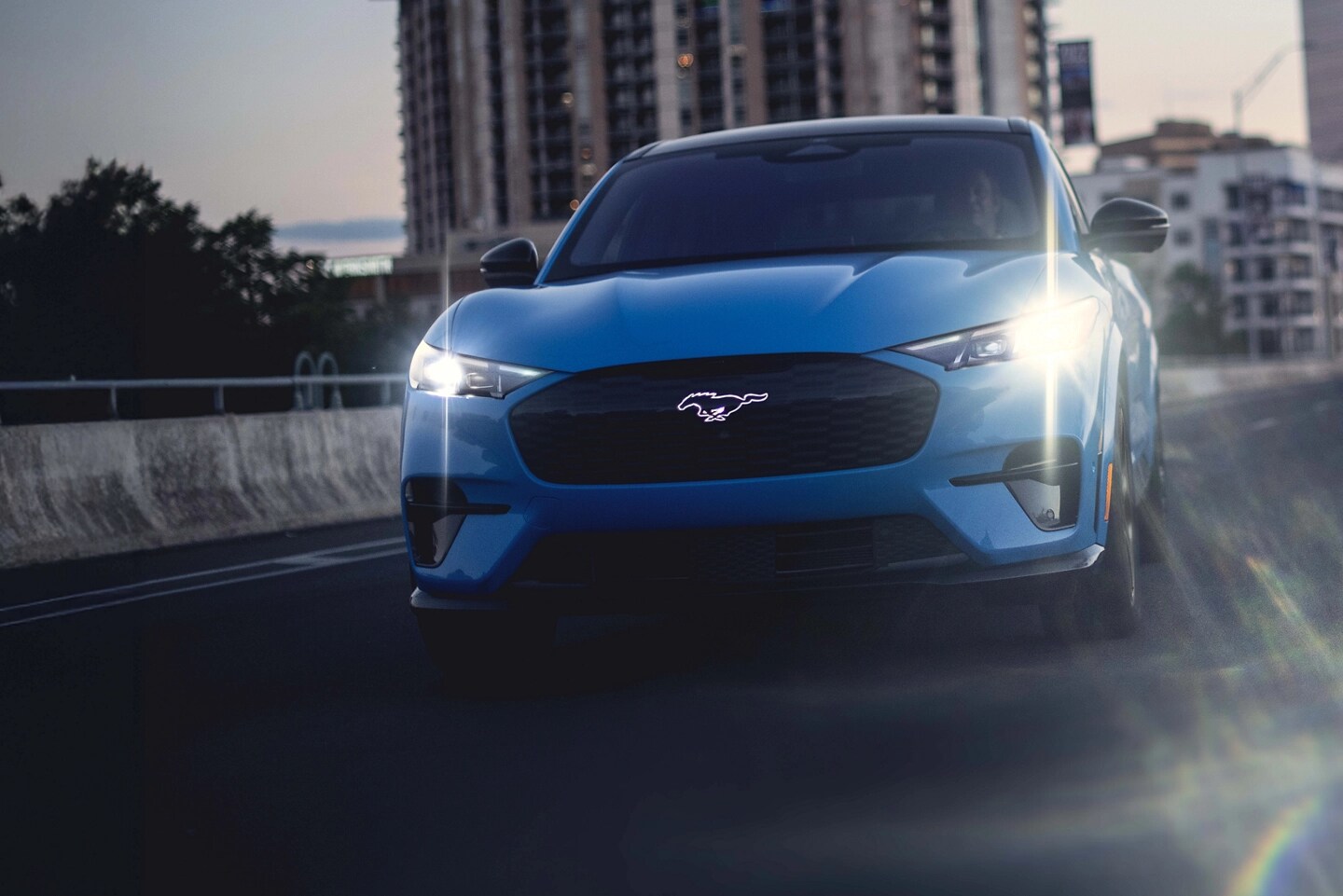 Mustang Mach-E driving on a highway.