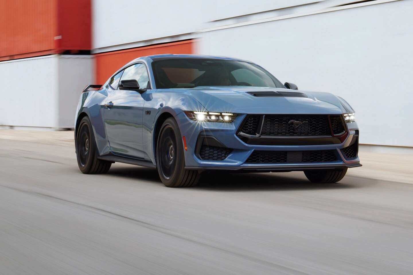 Mustang GT on an urban road.