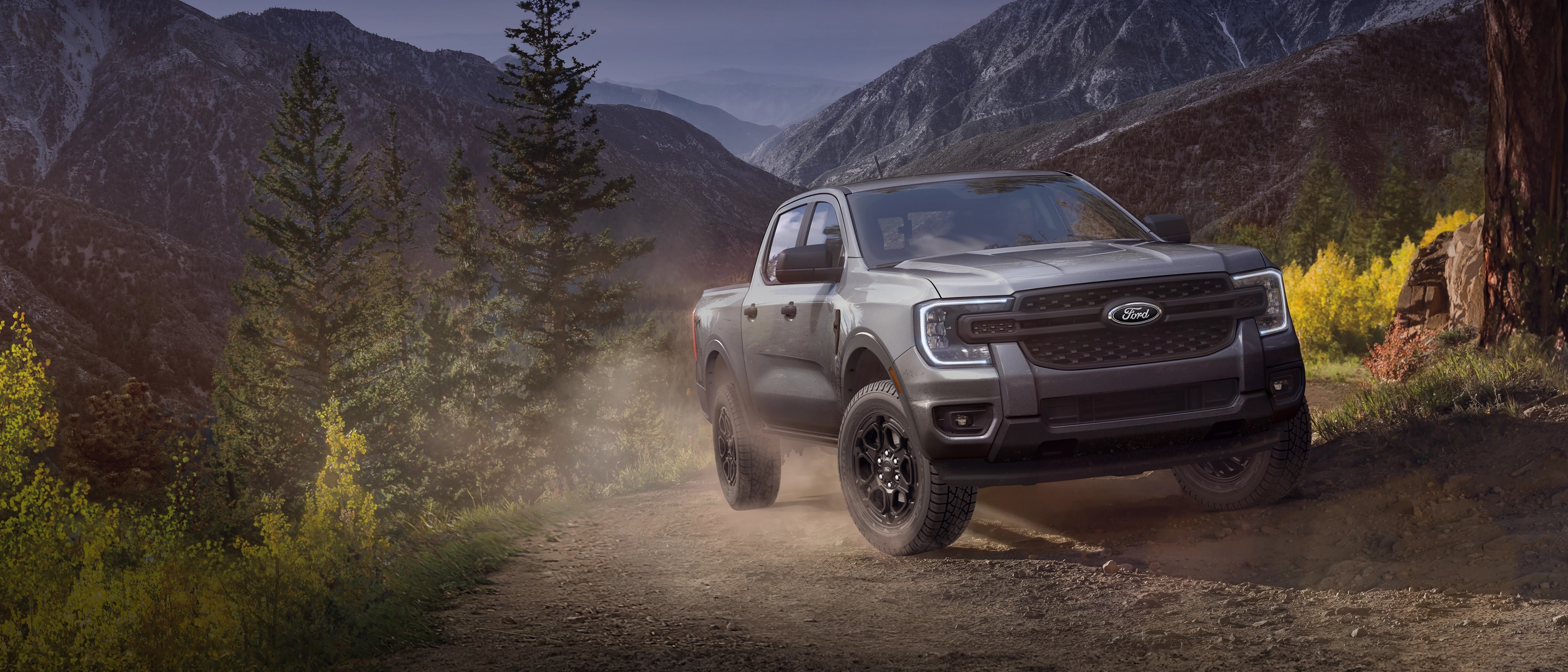 A 2025 Ford Ranger® truck being driven up a mountain trail