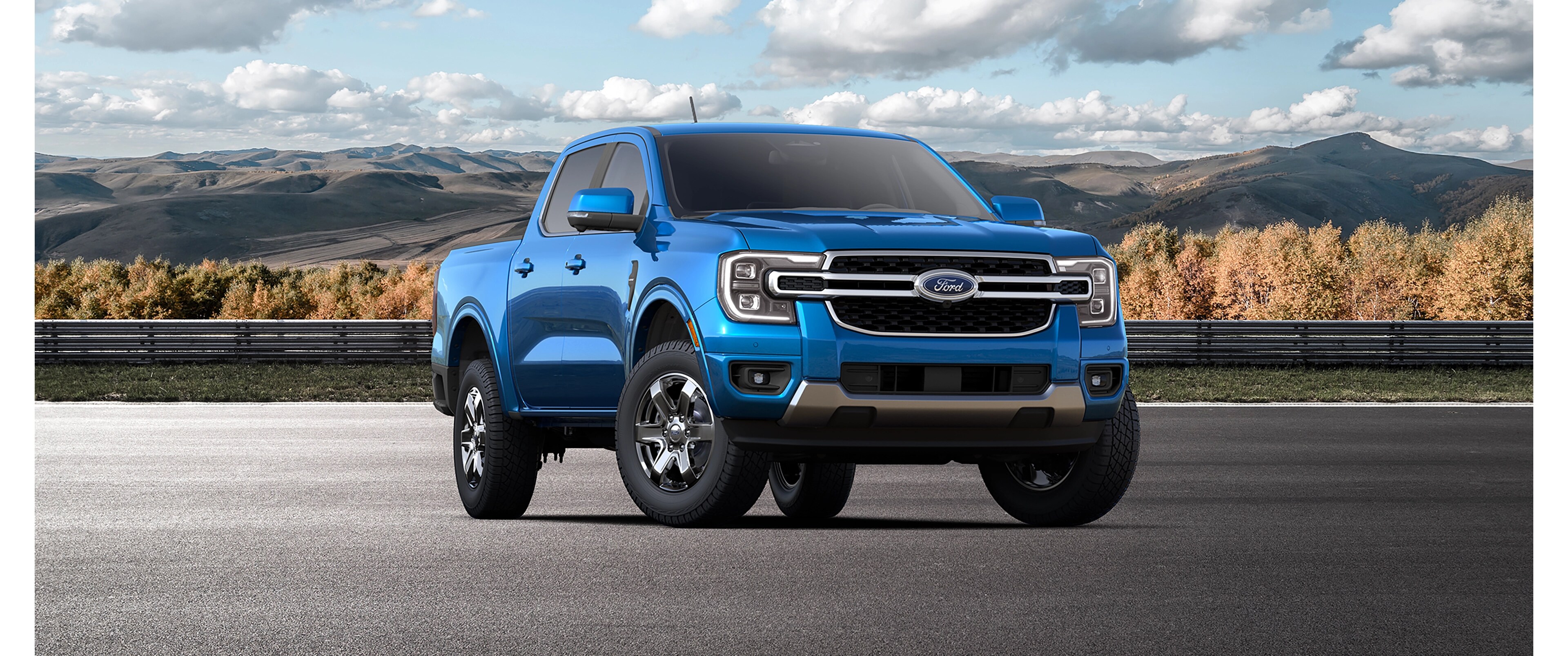 A 2025 Ford Ranger® with available Chrome Accent Package parked on the road with a mountainous background