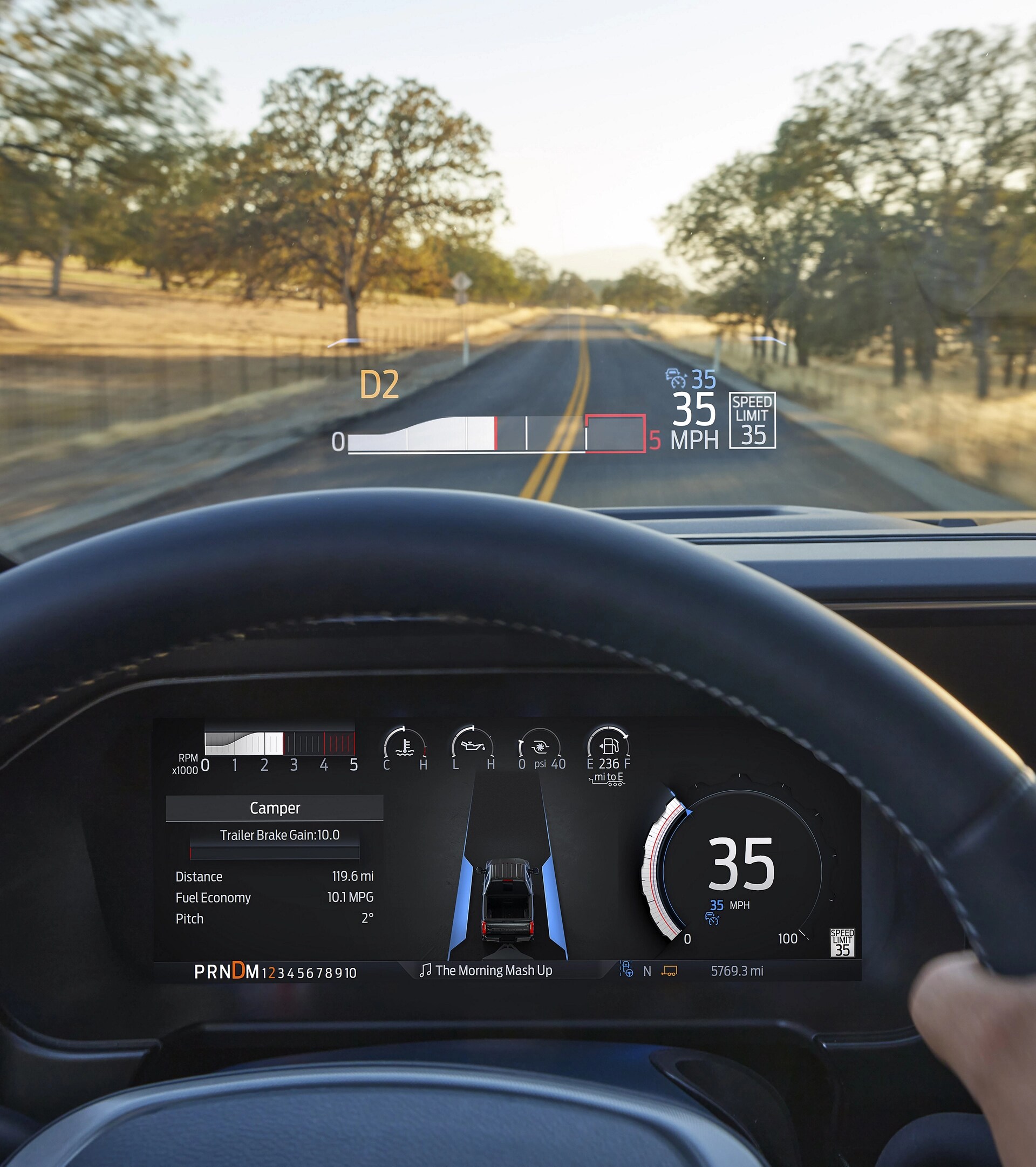 The driver's POV of the dashboard and windshield while using the head-up display feature