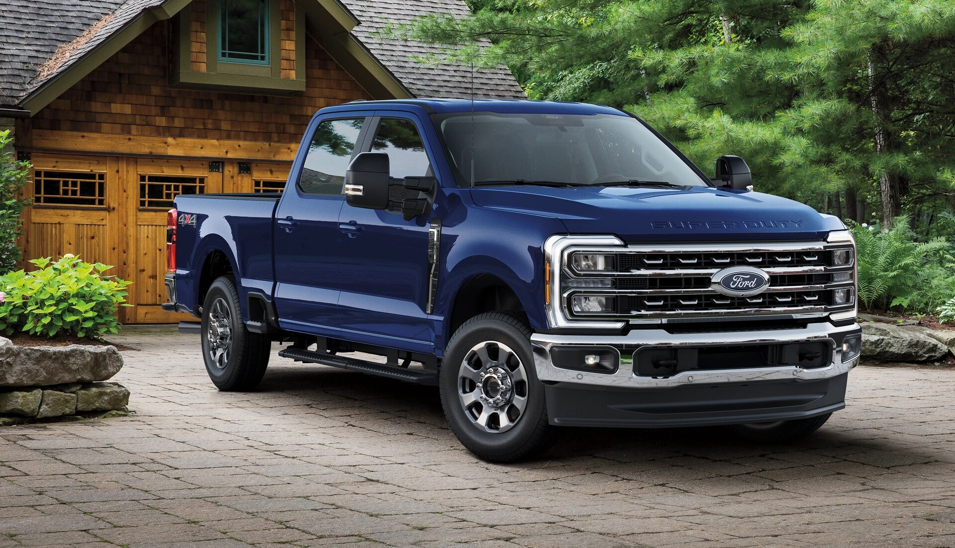 2026 Ford Super Duty® F-350® with the new Lariat® Premium Package parked in a grassy wooded area