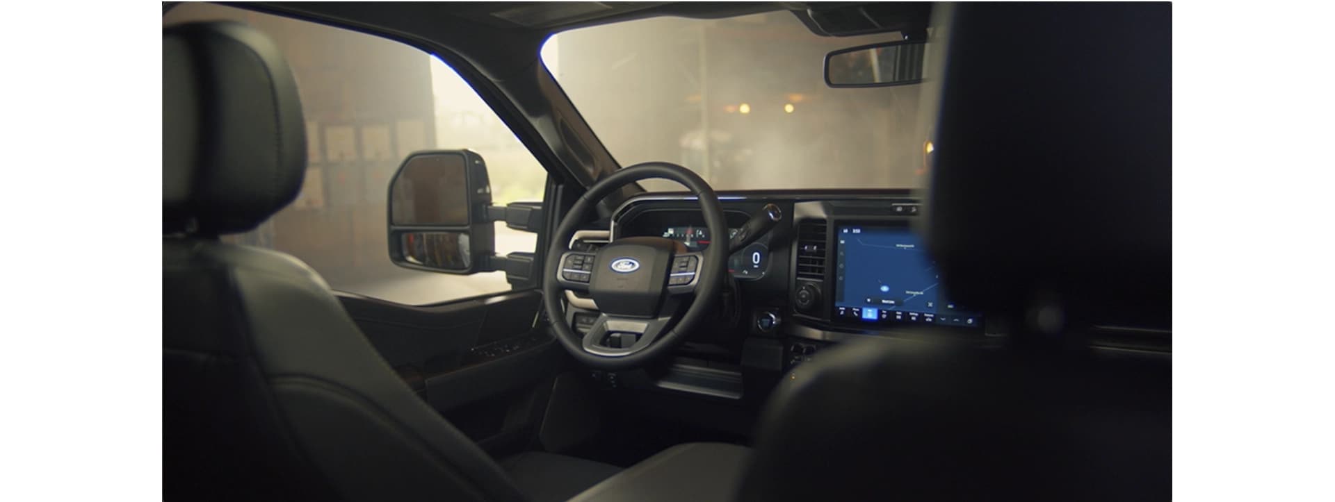 Interior of a 2026 Ford Super Duty showing the steering wheel and centre console touchscreen