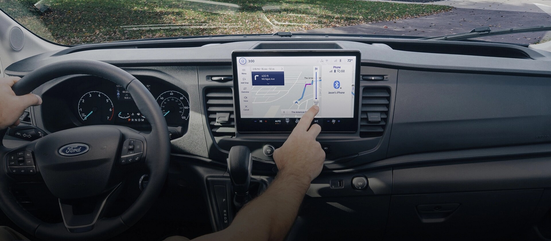 Interior of a 2025 Ford Transit® Van with a person interacting with the touchscreen