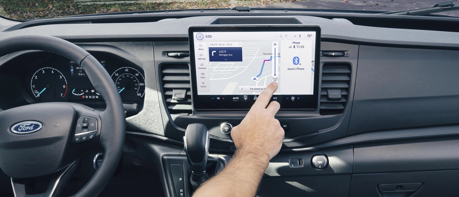 Interior of a 2025 Ford Transit® Van with a person interacting with the touchscreen