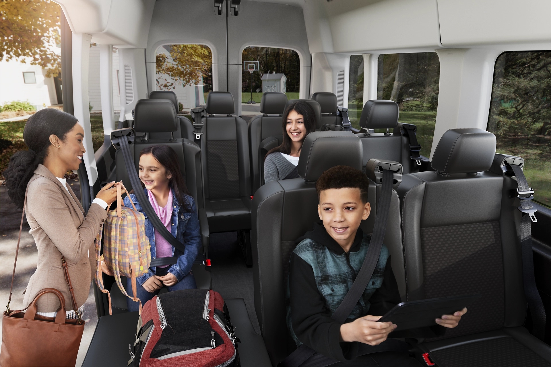 Interior view of people sitting in the rear seats of a 2025 Ford Transit® Van