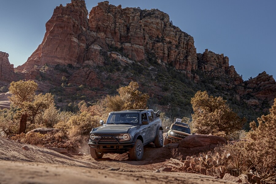 2021 Ford® Bronco™ Badlands™ in Area 51 paint being driven off-road through rocky terrain