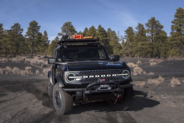 A 2-door 2023 Ford Bronco® Badlands™ model in Shadow Black with available aftermarket accessories