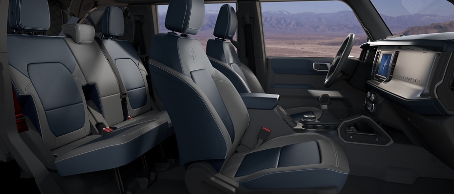 Interior of 2023 Ford Bronco® SUV with available leather-trimmed seats in Dark Space Grey with Navy Pier