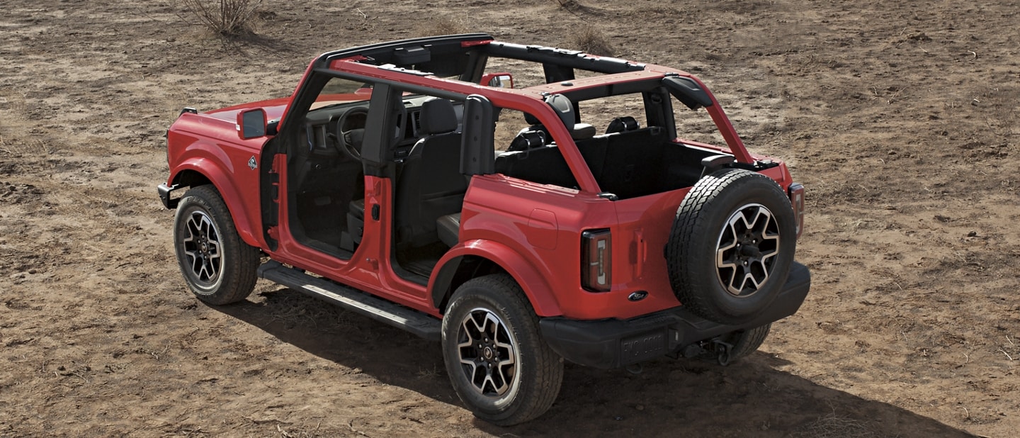 4-door 2023 Ford Bronco® Outer Banks™ model shown in Race Red with hardtop and doors removed