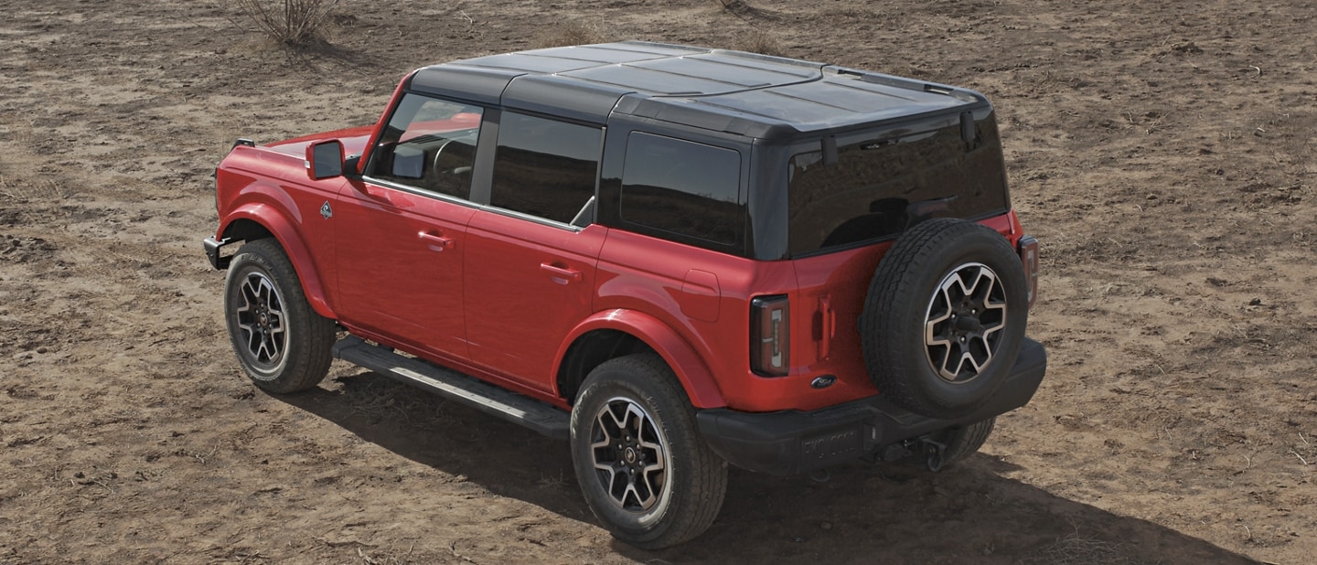 4-door 2023 Ford Bronco® Outer Banks™ model shown in Race Red with hardtop
