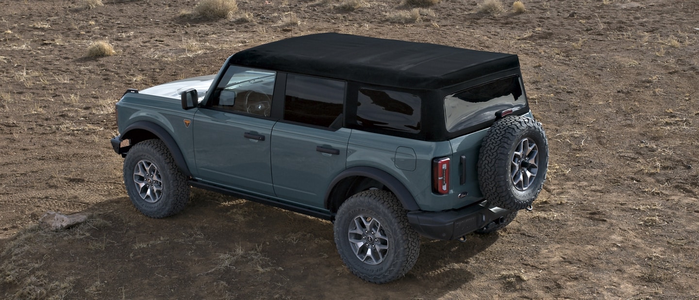 4-door 2023 Ford Bronco® Badlands™ shown in Azure Grey Metallic Tri-Coat with soft top roof