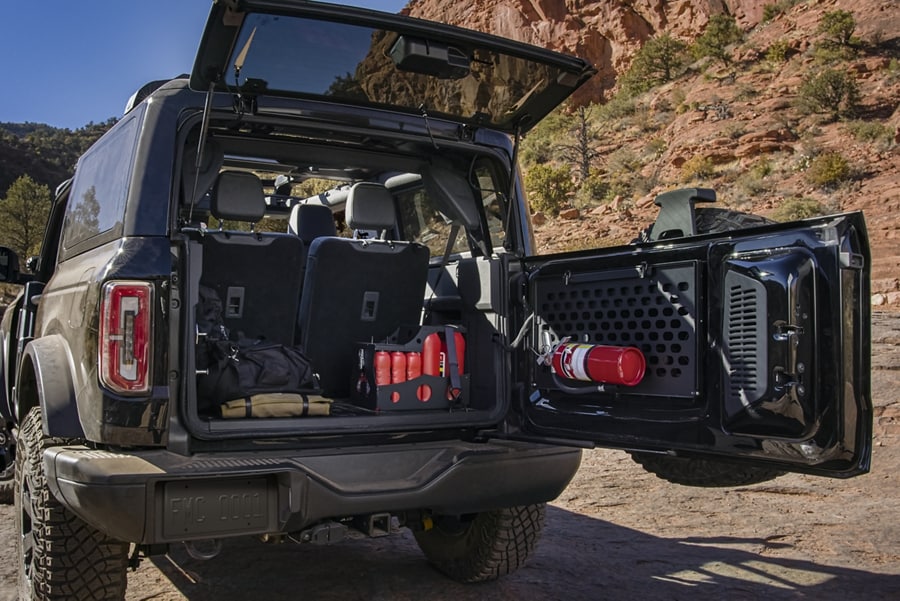 2-door 2024 Ford Bronco® SUV with the rear door open showing a loaded cargo area
