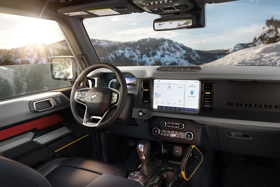 Interior view of the 2024 Ford Bronco® parked overlooking mountains