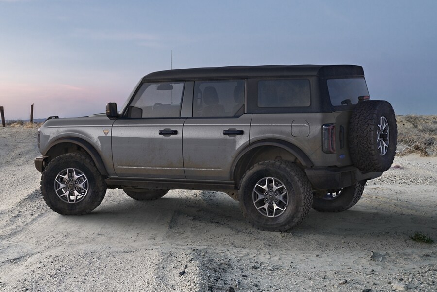 4-door 2024 Ford Bronco® Badlands™ parked on a desert sand dune