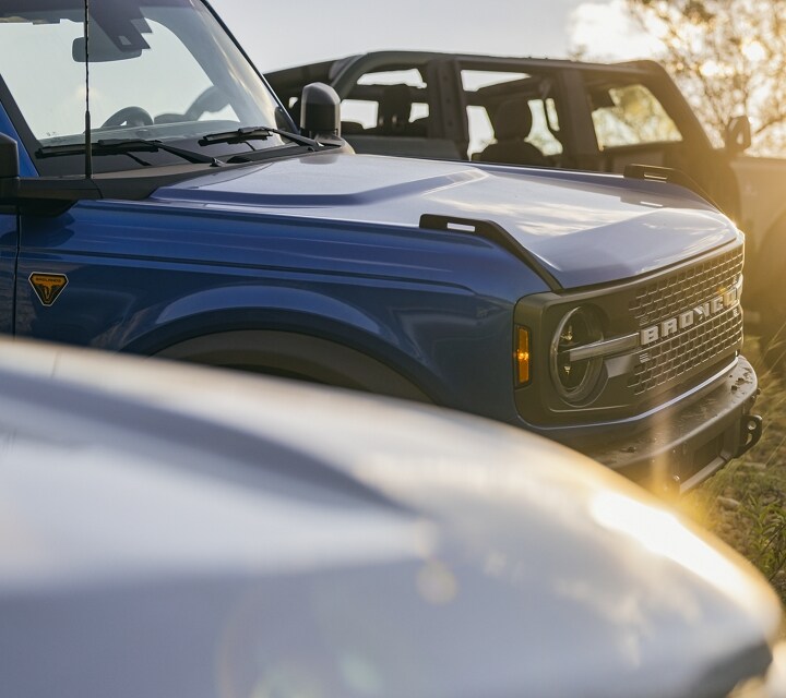 A group of 2024 Ford Bronco® SUVs parked on a hill