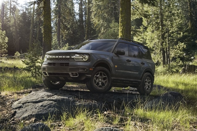 2023 Ford Bronco® Sport SUV parked on a rock slab in a wooded area