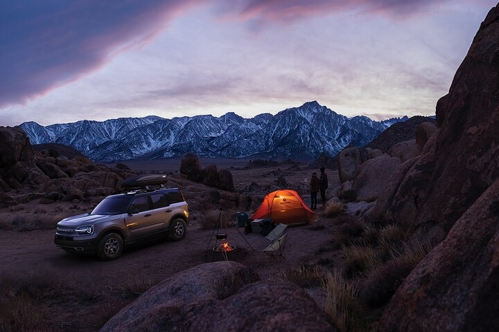 2023 Ford Bronco® Sport SUV parked in a rustic area with a tent