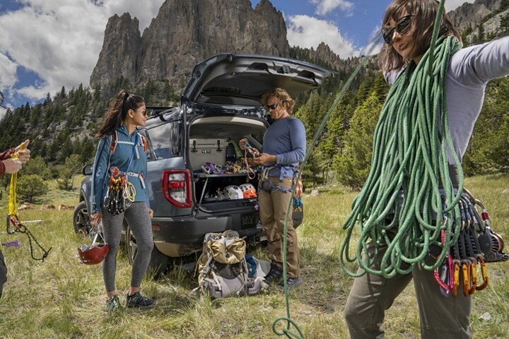 Shown is a 2023 Ford Bronco® Sport SUV parked on the grass near a rock wall