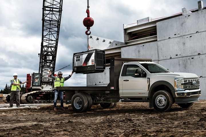 2023 Ford Super Duty® Chassis Cab with flat bed body on a job site
