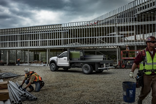 2023 Ford Super Duty® Chassis Cab with upfit parked at a job site with workers present
