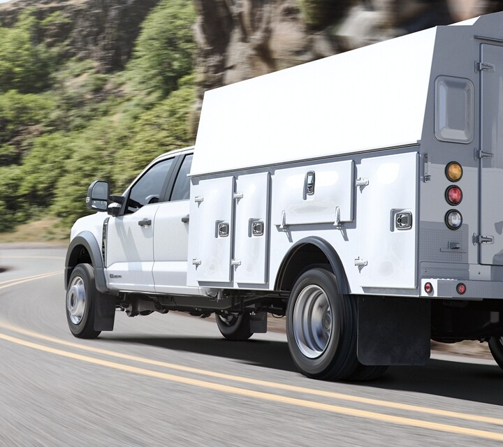 2025 Ford Super Duty® F-350® XL with a utility box being driven down the road