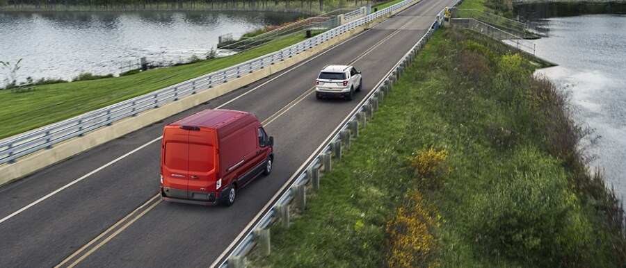 2023 Ford E-Transit™ van being driven down the highway