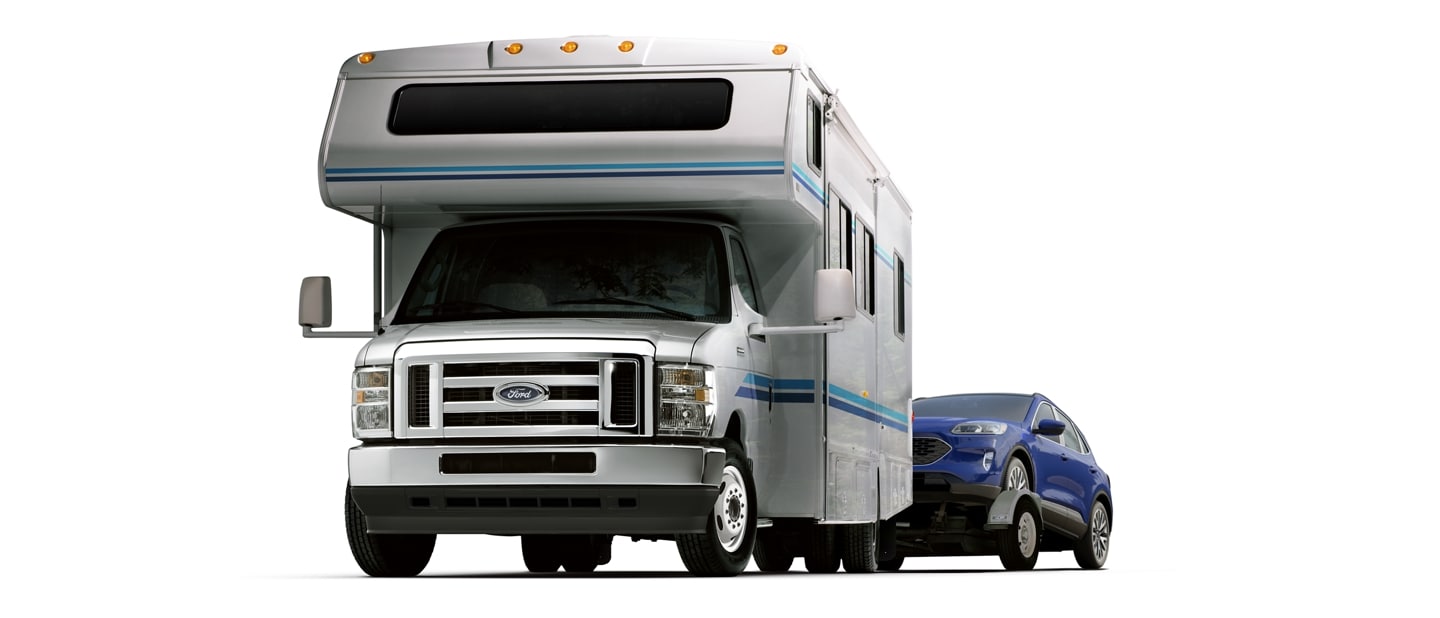 2024 Ford E-Series Cutaway with Class C motorhome towing a car on a trailer