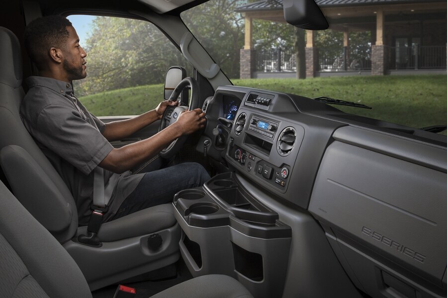 A man in the driver’s seat of a 2025 Ford E-Series Cutaway