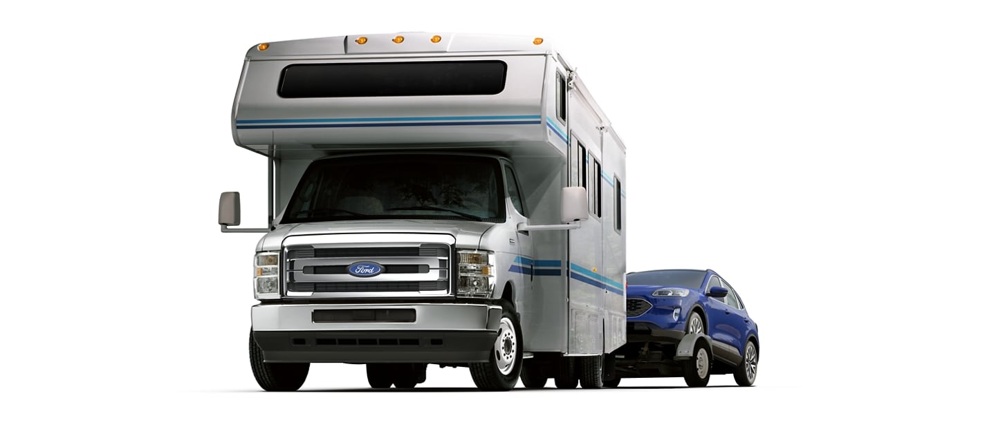 2026 Ford E-Series Cutaway with Class C Motorhome towing a car