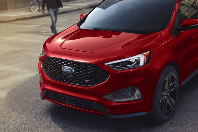 Three-quarter view of the front of a Ford Edge® ST SUV in Rapid Red