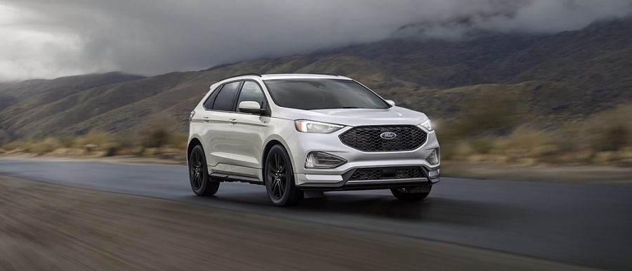 2024 Ford Edge® ST-Line model in Iconic Silver being driven on a desert road