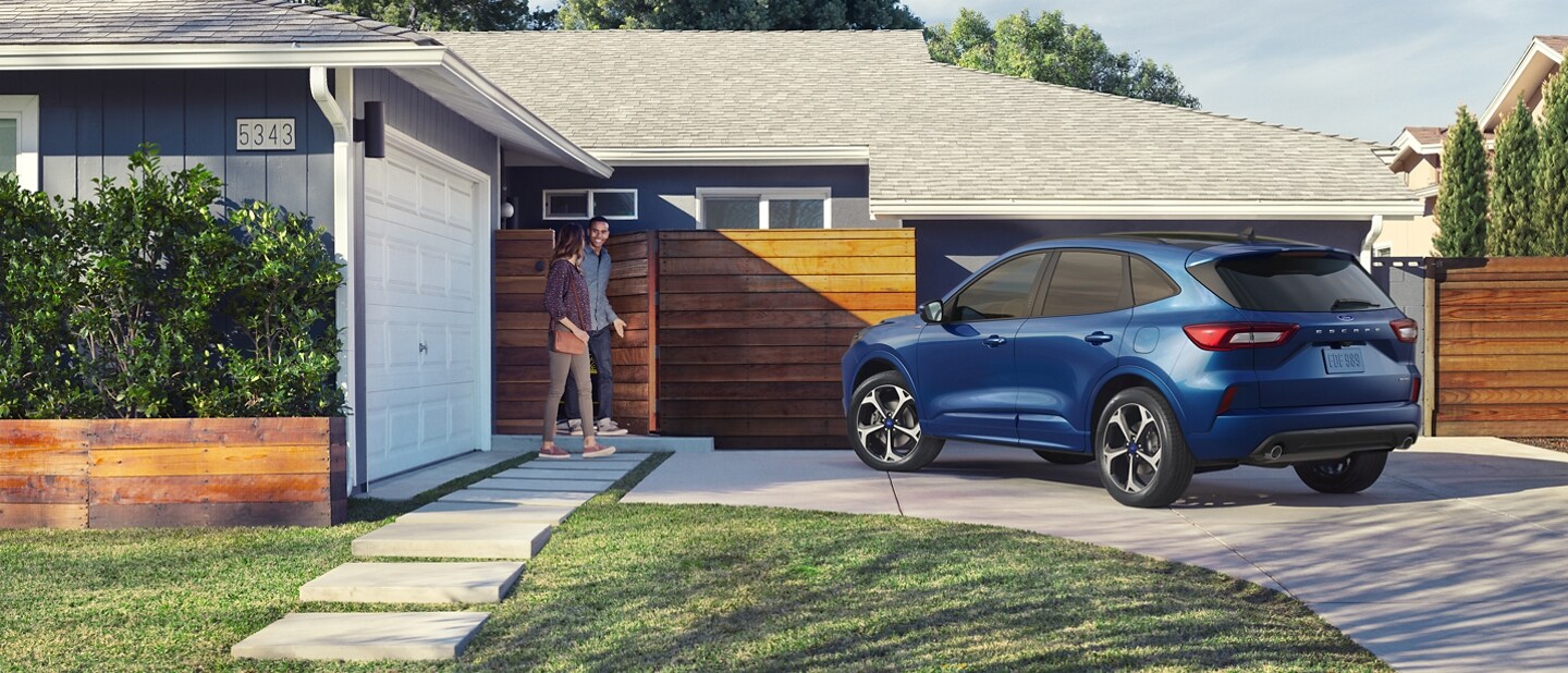 2023 Ford Escape® in Atlas Blue parked in a driveway