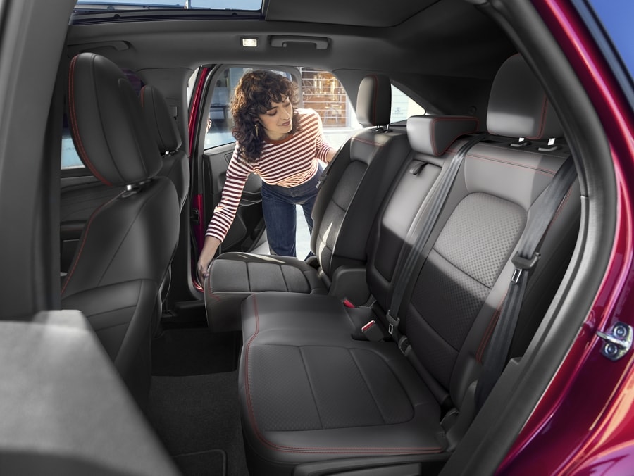A woman seen pulling down one side of the rear 60/40 seats